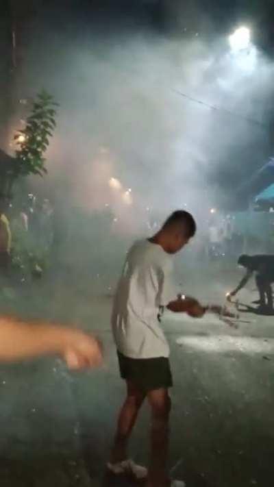 WCGW lighting a firecracker