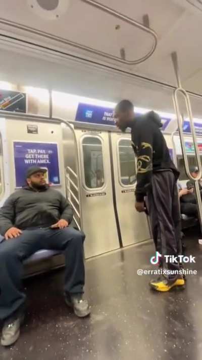 Dude does the ultimate flex during discussion in NYC subway