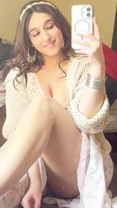 Noor Arora opening up her legs for you-reveals full thighs with a glimpse of her white panties.