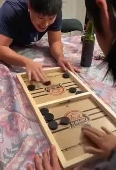 Dexterity game on one side and a strategy game on the other side