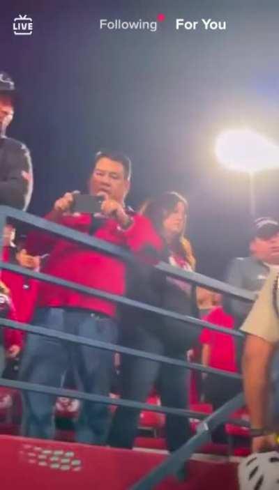 pouring a beer on a dude getting arrested