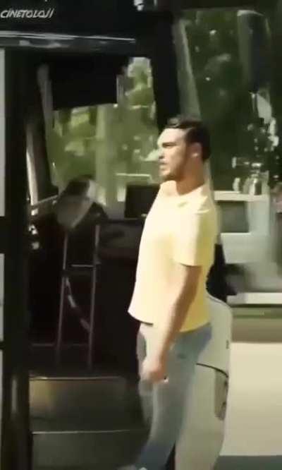 Hanging outside a moving bus