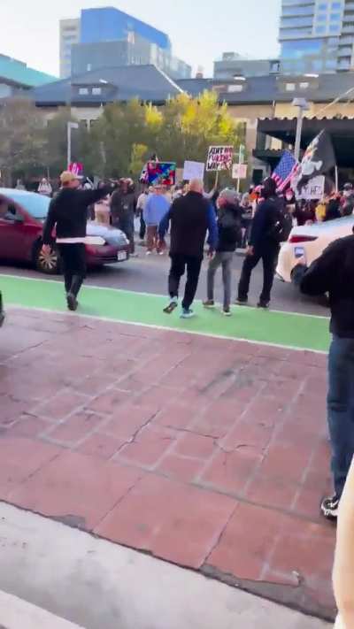 MAGA man falls on his face after yelling slurs