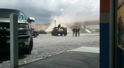 Holy shit war zone type of feeling here. This was in Tamaulipas Mexico. Mexican military against sicarios