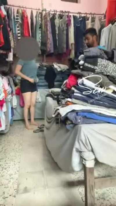 Changing Dress in Front of Shopkeeper