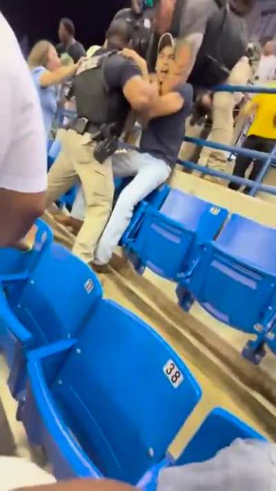 Man Fights While Holding Baby at School Graduation in Columbus, Georgia