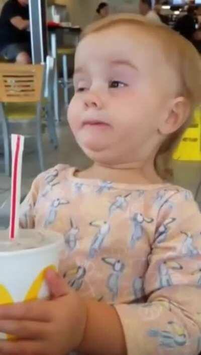 Little girl tries cola for the first time