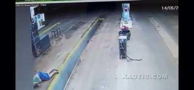 Dude on a motorcycle does a buttery face crayon on smooth concrete.