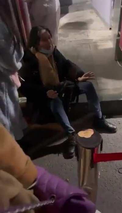 Woman in China suffocating in front of hospital but refused entrance because she had a fever. She died as a result.