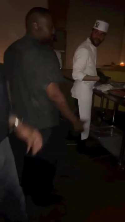 Ye celebrating his birthday with a goddess acting as a food trey