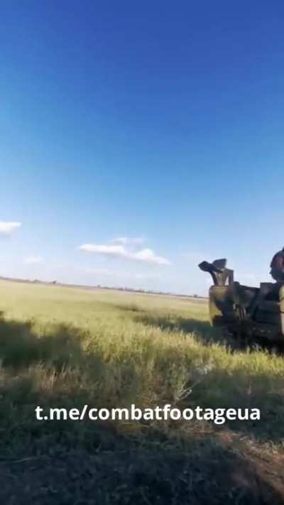 Ukrainian soldiers are firing at Russian positions with a 100mm MT-12 Rapira cannon mounted on an MT-LB.