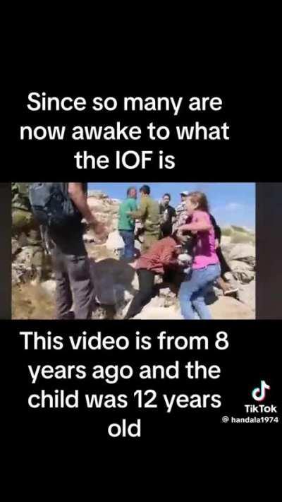 IOF soldier attempting to kidnap a 12 year old boy with a broken arm