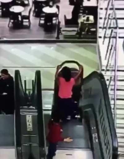 Unattended kids fall down escalator
