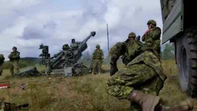 Canadian soldiers waking up their buddy