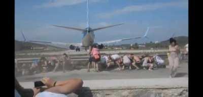 Standing behind a plane