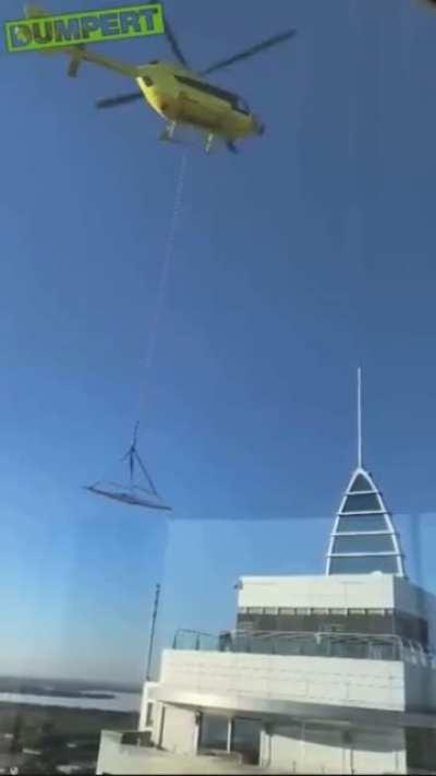 to transport a big glass panel by helicopter