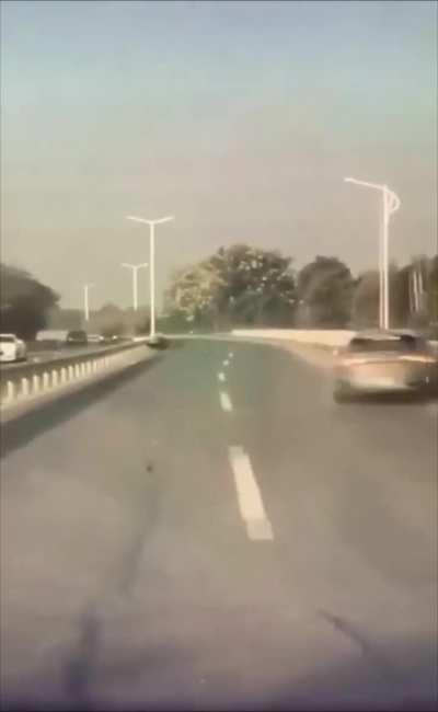 Dude tries to cross a Highway in China 