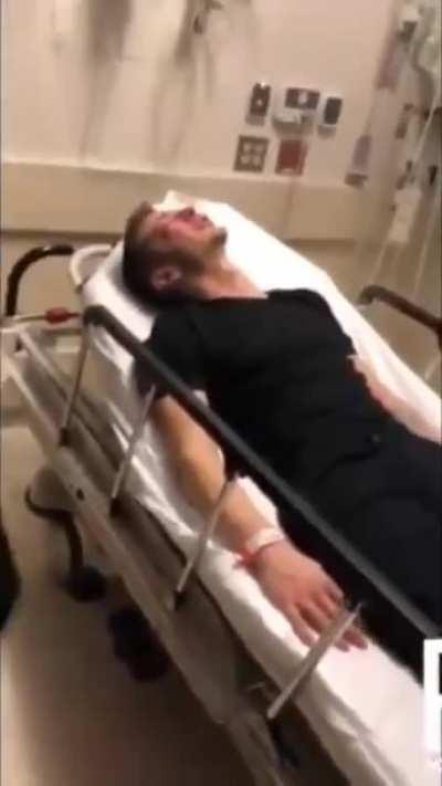 Two cops film themselves assaulting a man in a hospital bed.