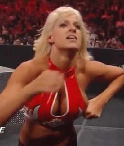 Maryse adjusting her top