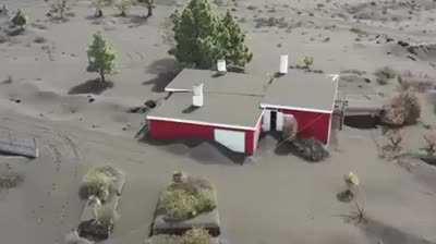 Towns submerged in ash near the La Palma volcano in Spain
