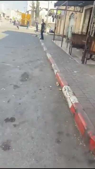 Palestinian school children cry and flee after Israeli forces fired tear gas at an elementary school in the West Bank city of al-Khalil (Hebron). Death to Israel