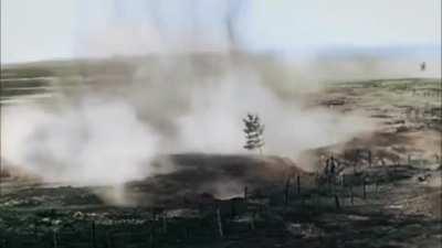 Colorized World War I footage of German soldiers advancing through No Man’s Land under enemy artillery fire.