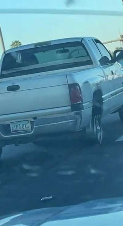 Truck driving on a blown out wheel casually