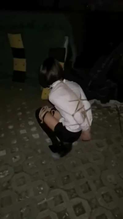 Tied up asian girl outside