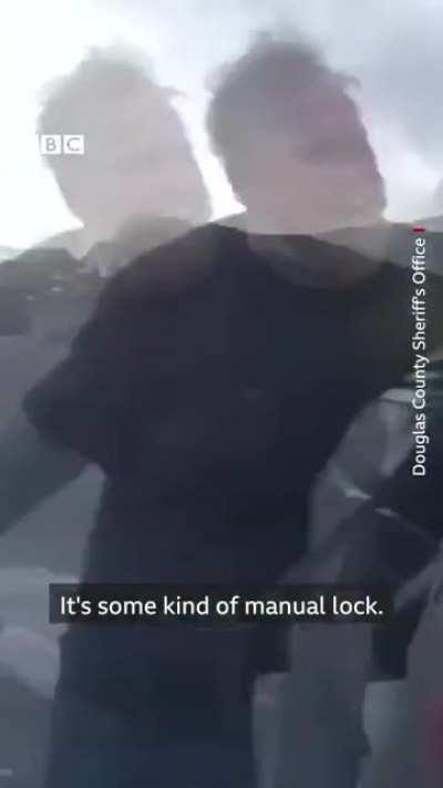 Police bodycam footage shows rescue of dog from a burning car in Colorado. Credit: the BBC