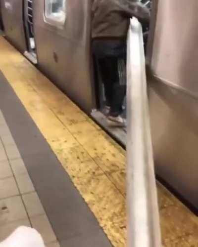NYC Entrepreneur is seen on his way to the nearest $crap metal recovery $hop via the MTA $ubway. Of course kind New Yorkers lend a hand to get it fully loaded into the tight subway car.