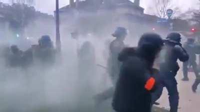 WCGW discharging a tear gas in a riot line