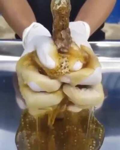 Squeezing a honey comb