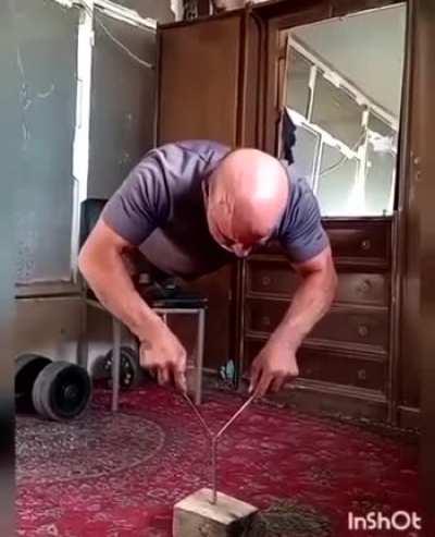 Push-ups with screwdrivers on a hammered nail...