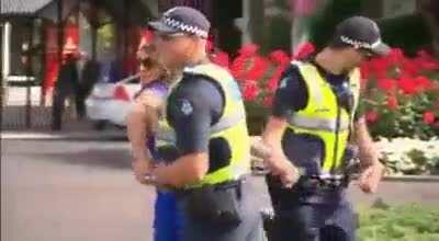 Lady pushes cop, then get arrested.