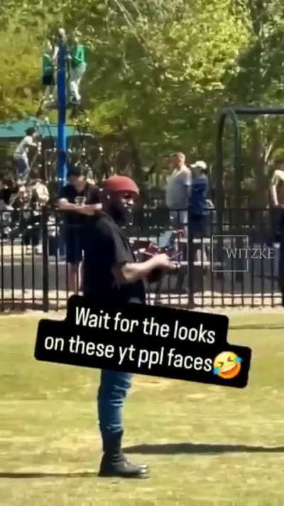 African American activists march on a white-majority neighborhood park