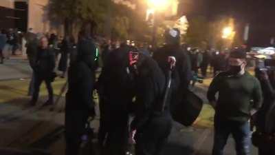 A Group of Individuals Outside The White House Looking Like Something Straight Out of The Purge