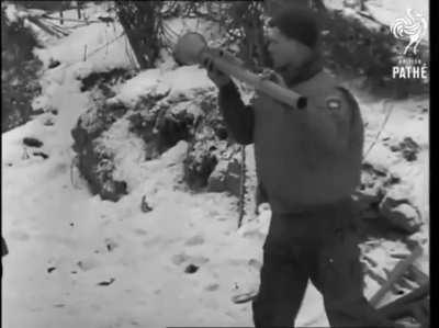 US troops testing a panzerfaust on a knocked out Tiger II.