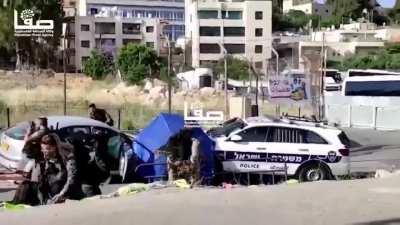 Driver rams into officers, injuring six of them.