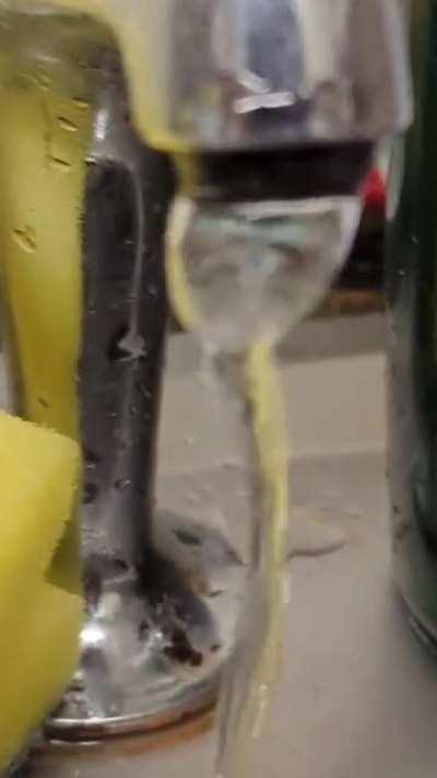 Vortex being temporarily formed by running tap? I've never seen this before