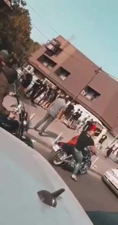 Macedonian men singing derogatory chants to Albanians while they're passing by, run away when Albanians stop and things are about to get real...