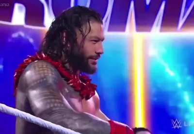 Roman Reigns smelling weed off a member of the live audience 