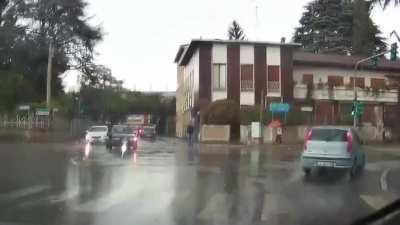 Riding a scooter in the rain