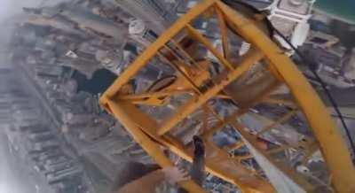 Climbing a crane in Dubai.