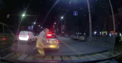 Hopping out of a car in the middle of traffic.