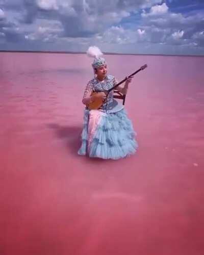 A dombra performance by a 23-year-old Kazakh musician in Lake Köbeituz, a salt lake in Kazakhstan that turns pink every several years.