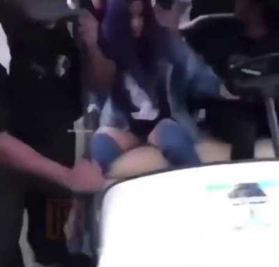 Lizzo in the back of the golf cart