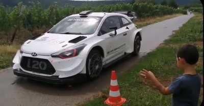 Rally driver makes a kid's day.