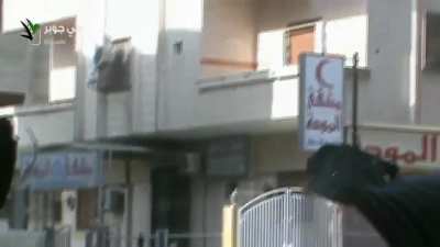 FSA fighters struggle to get a wounded civilian out of the line of fire - Jobar, Damascus - 2013