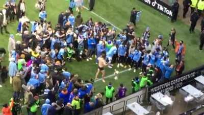 Former Celtic manager Ronny Deila celebrates the MLS Cup win with NYCFC fans by stripping to his boxers and doing push ups