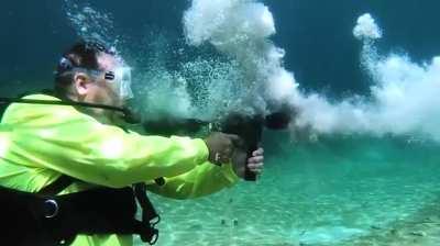 Firing a submachine gun underwater